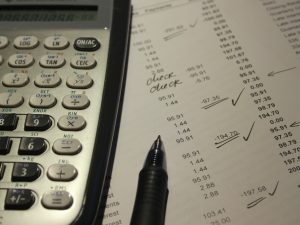 A calculator and accounting sheet